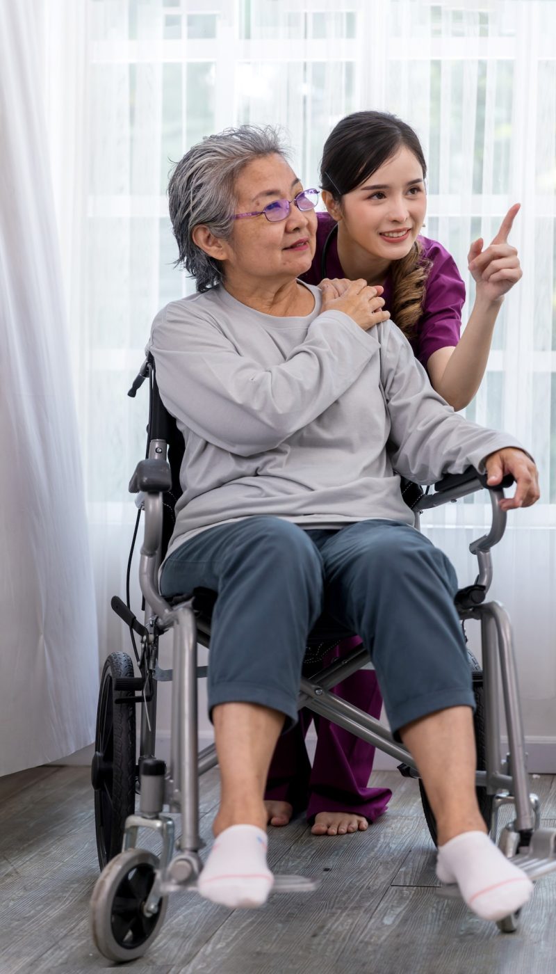 caregiver-nurse-take-care-a-senior-patient-sit-on-wheelchair-nurse-helping-senior-woman.jpg